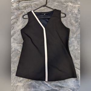 Professional black blouse with white accent